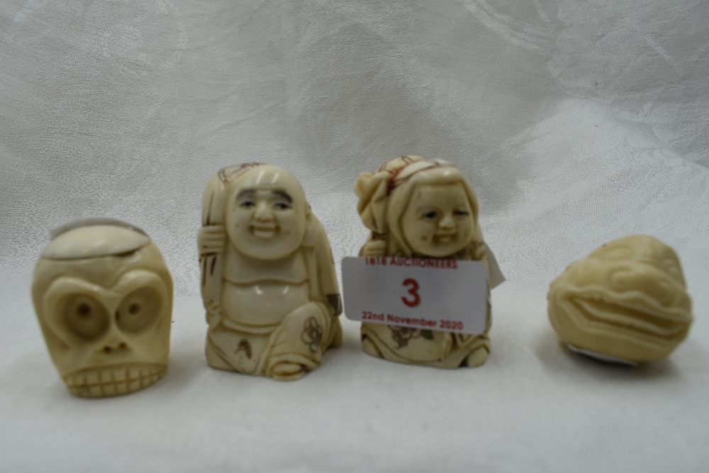 A selection of hand carved Japanese Netsuke and Okimono including double faced monkey head, Moks and