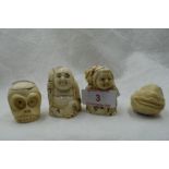 A selection of hand carved Japanese Netsuke and Okimono including double faced monkey head, Moks and