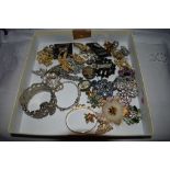 A selection of costume jewellery brooches and bangles including enamelled and diamante