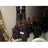 A selection of binoculars including Miranda 16x50 Tasco 7x50 and Omega 30x50 all having cases