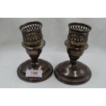 A pair of squat American candle sticks by La Pierre also stamped Sterling
