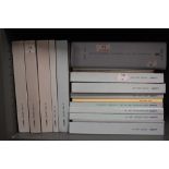 A collection of Lladro bound catalogues and books.