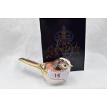 A Royal Crown Derby Longtail Tit paperweight, boxed with gold stopper