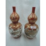 A pair of antique export mirrored double gourd vase possibly Japanese extensively decorated with
