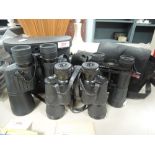A selection of binoculars including Helios 7x50 Regent 8x40 and similar all with cases