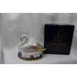 A Royal Crown Derby Swan paperweight, boxed with gold stopper