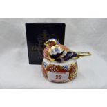 A Royal Crown Derby Chaffinch nesting paperweight, boxed with gold stopper