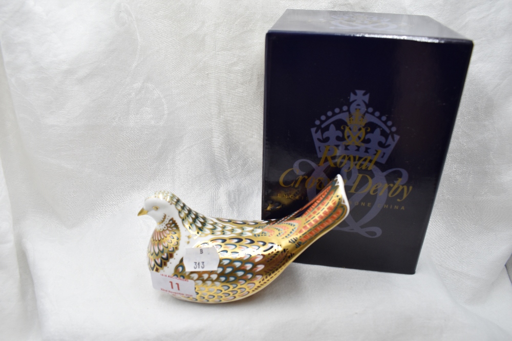 A Royal Crown Derby Turtle Dove paperweight, boxed with gold stopper