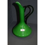 A vintage green glass jug.