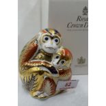 A Royal Crown Derby Monkey and Baby paperweight, boxed with gold stopper