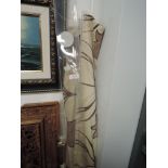 Two Dunelm mill blinds having beige ground with taupe and crimson tulip pattern.