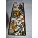 A small selection of costume jewellery including clip back earrings, pendants, enamelled cross,