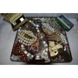 A tray of costume jewellery including Rosary beads, SOS pendant, simulated pearls etc