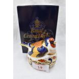 A Royal Crown Derby Gold Finch nesting paperweight, boxed with gold stopper