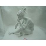 A modern ceramic figure study by Kaiser of girl sitting playing flute