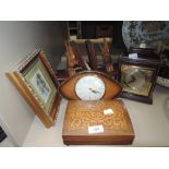 A selection of mantle items including book ends clock and Thorens music box