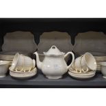 A part tea and dinner service by Wedgwood having cream glaze and black back stamp