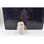 A Royal Crown Derby Collectors Guild Owlet paperweight, boxed with gold stopper