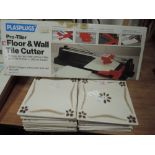 A Plasplugs tile cutter in box and some tiles.