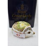 A Royal Crown Derby Collectors Guild Primrose Hedgehog paperweight, boxed with gold stopper