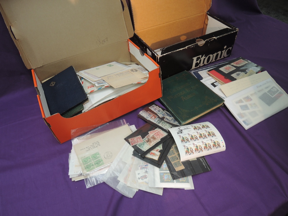 Two small boxes of World Stamps, mint and used, mainly on stock cards