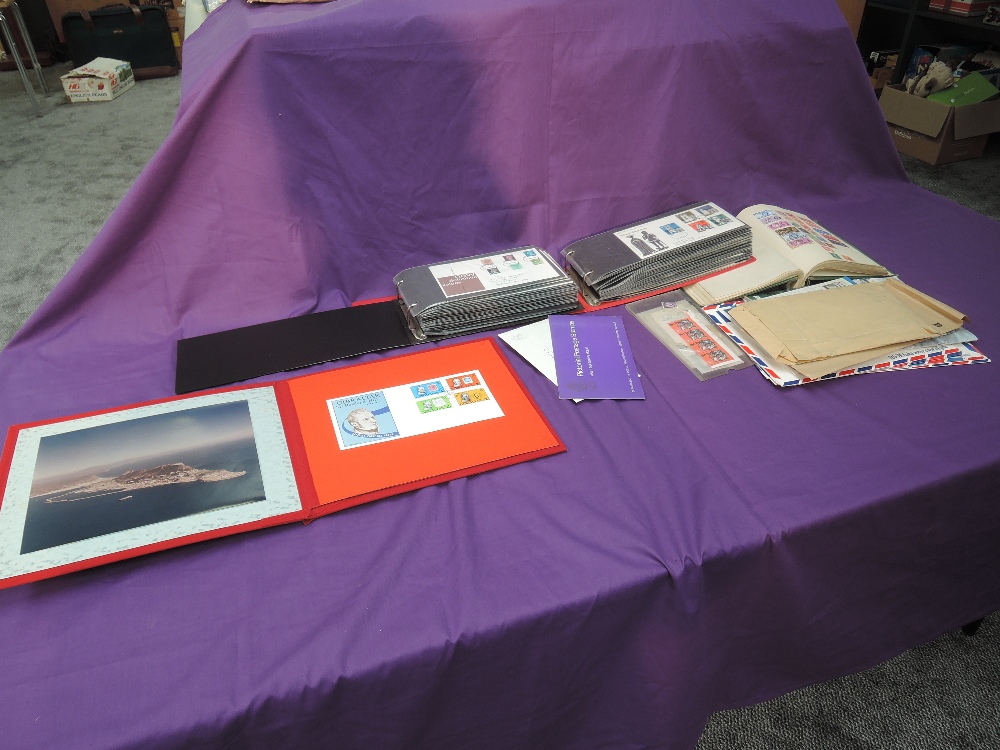 A box of GB First Day Covers and Stamps, World album, British Airways Stamp Packs etc