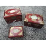 A selection of oriental jewellery cases having carved Jade style panels to top
