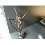 A Victorian French spelter figure of an angel stringing bow on marble base