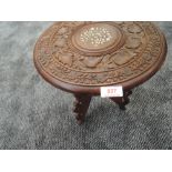 A small hand carved Indian table