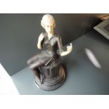 An Art Deco bronze styled figure of a seated dancer approx 25cm high