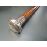 A walking cane having Hm silver handle