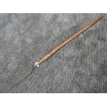 A small tribal spear having wood shaft with wrought iron tip measuring 104 cm long possibly from the