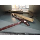 A small naive native crossbow and arrow in quiver