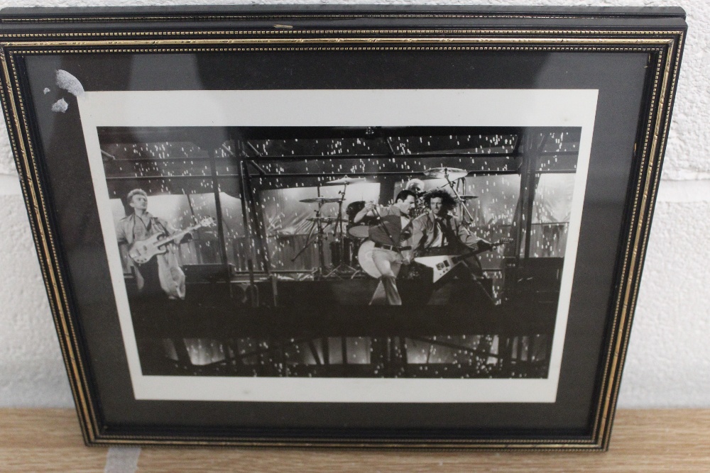 Two framed photos taken during the filming of the' It's a kind of magic' video. - Image 2 of 3