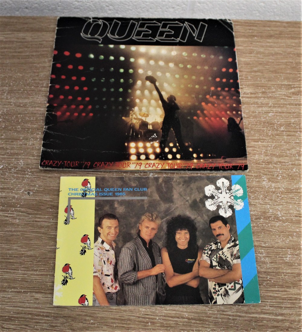 A 1985 Christmas fan club magazine and a 1979 crazy tour programme.