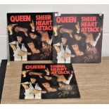 Three copies of sheer heart attack vinyl albums.