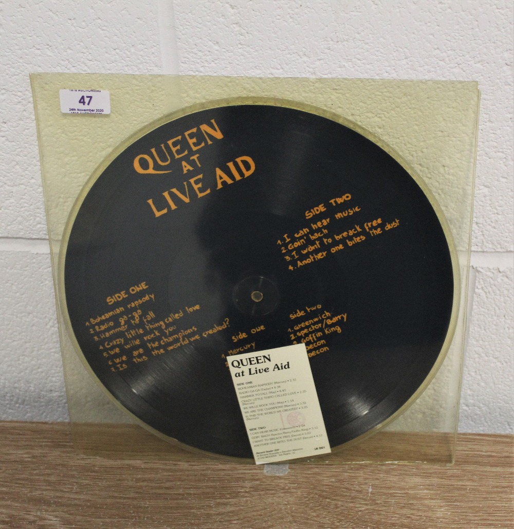 Queen at live aid and Larry Lurex demo picture disc.