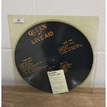 Queen at live aid and Larry Lurex demo picture disc.