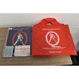 A Freddie Mercury tour programme,ticket and carrier bag.
