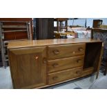 A vintage Ercol sideboard, mid colour, on shepherds castors, dimensions approx. W156 D46 H70cm