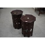 A pair of carved Islamic art style occasional tables, decorated with mother of pearl inlay, damaged