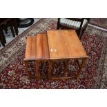 A vintage G plan style teak nest of three tables