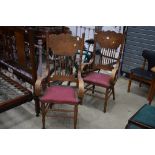 A pair of traditional stained frame carver chairs
