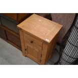 A modern oak bedside cabinet