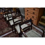 A set of five (four plus one) early 20th Century Regency style mahogany dining chairs