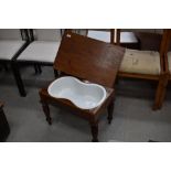 A Victorian mahogany bidet (or baby bath) on turned legs