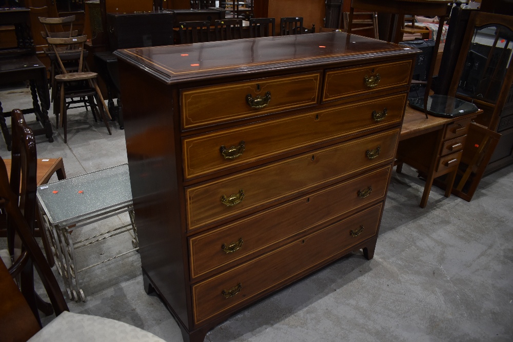 A late Victorian mahogany and satinwood inlaid chest of two over four drawers, stamped for James