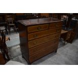 A late Victorian mahogany and satinwood inlaid chest of two over four drawers, stamped for James