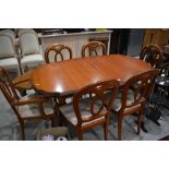 A modern extending dining table good quality (Rossmore or similar) possibly Cherry and six (four