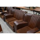 A 1930s brown leather or rexine three piece suite in classic art deco style